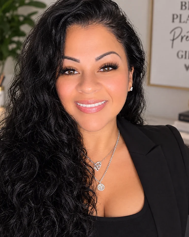Adelita Torres Slater at her desk in the AMORE Slay and Co studio